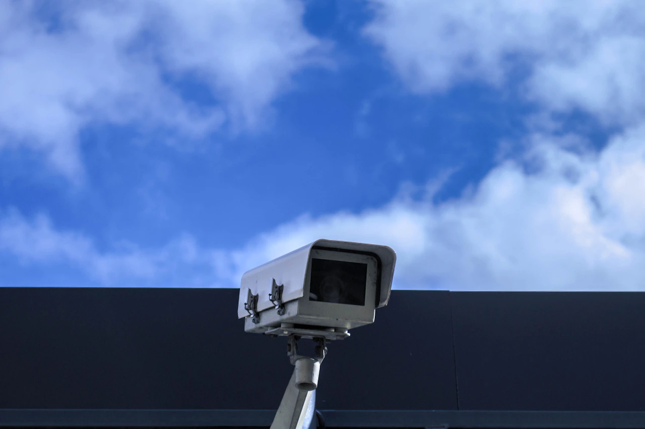 Outdoor security camera mounted on a building